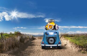 Volkswagen Beetle parked in the summer time at the beach