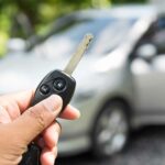 Woman locking her car to prevent theft