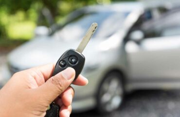 Woman locking her car to prevent theft